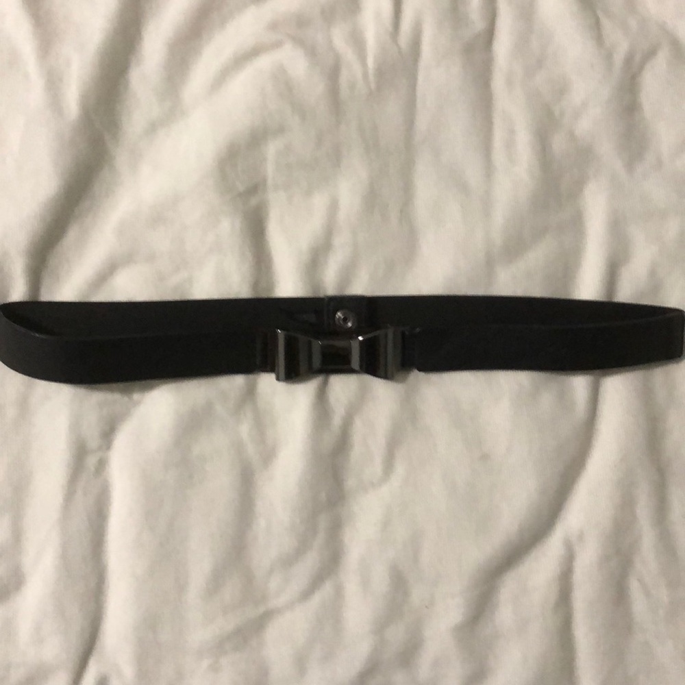 Free w/ purchase. Stretch and leather belt w/ bow